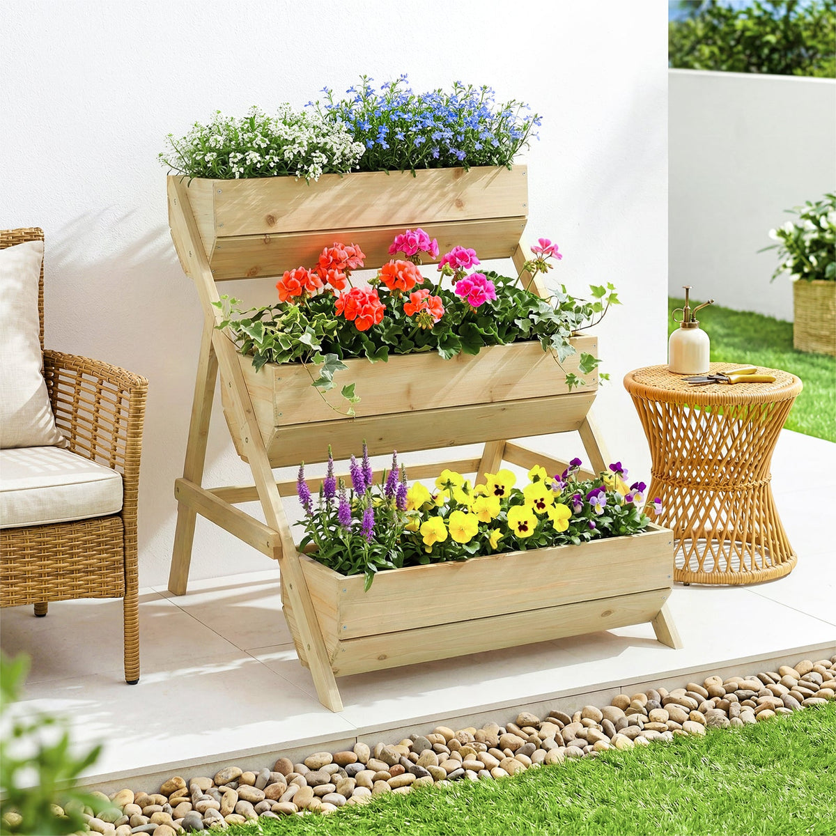 Natural wood three-tier planter with red and yellow flowers on a terrace