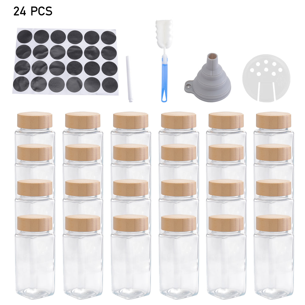 The 24-jar set on white: twenty-four glass jars with bamboo lids, labels, pen, brush, funnel and sifter