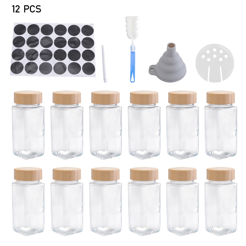 The 12-jar set on white: twelve glass jars with bamboo lids, labels, pen, brush, funnel and sifter