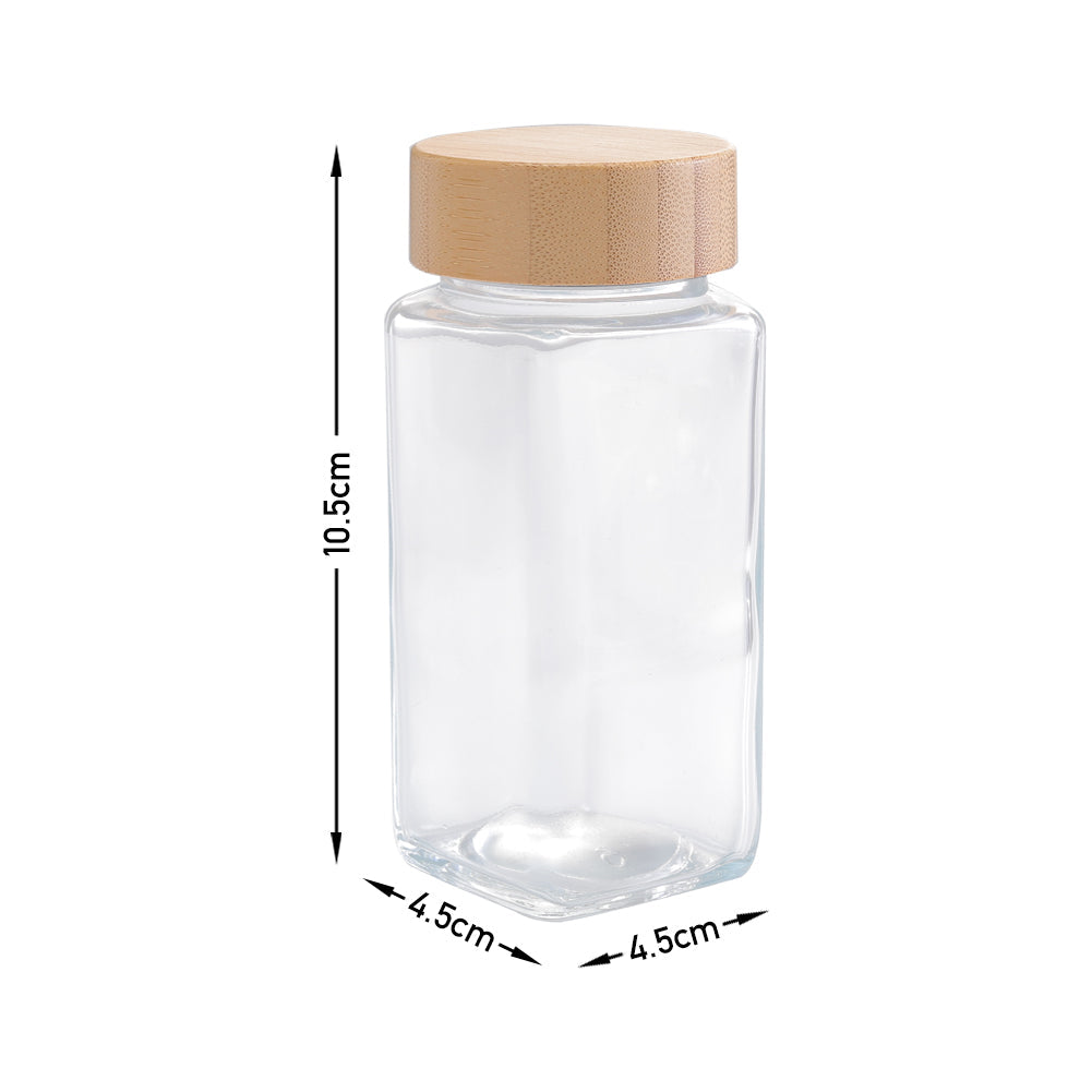 Glass spice jar with bamboo lid on white, marked 10.5 cm tall and 4.5 cm square