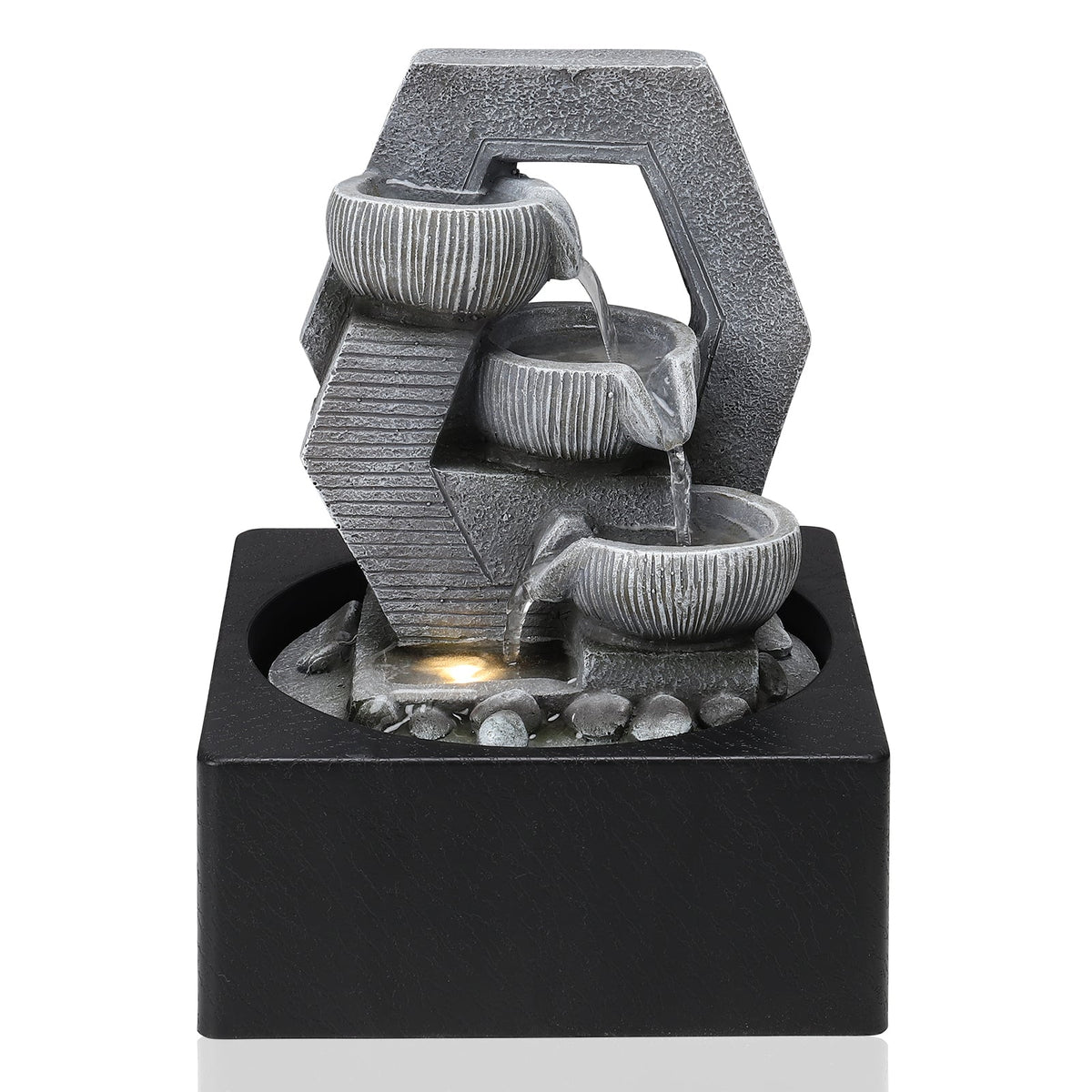 Grey resin tabletop fountain with three ribbed bowls in a hexagonal frame on a square black basin