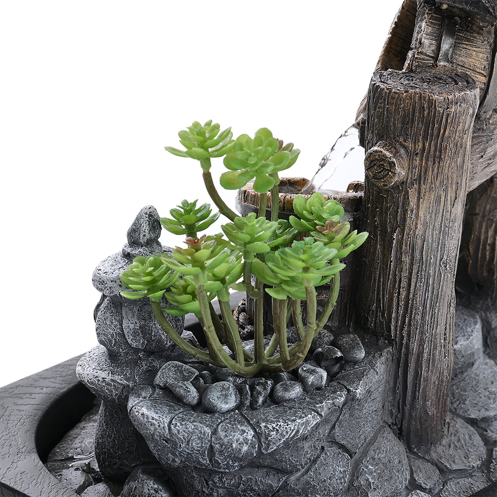 Close-up of the small artificial succulent and the pebble-effect base