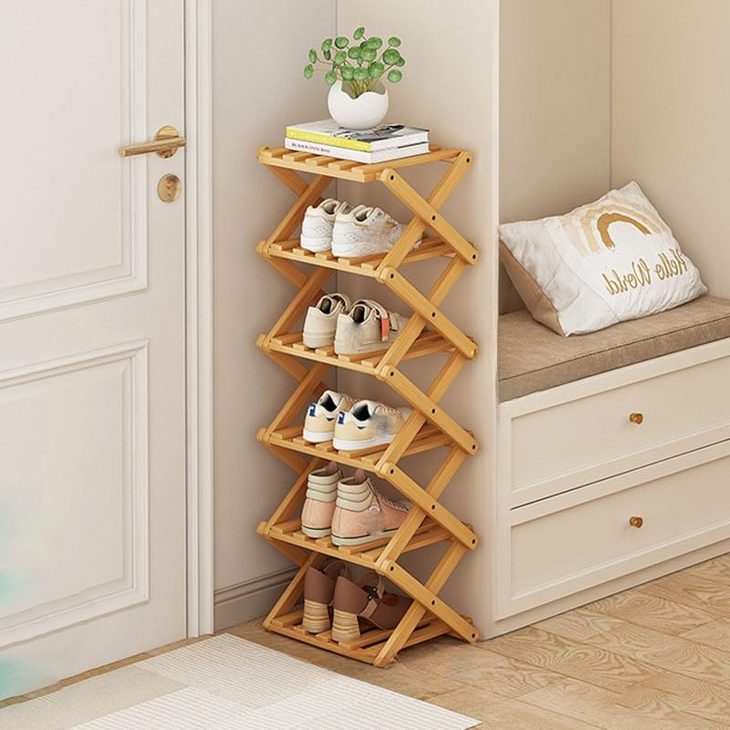 Light bamboo six-tier shoe rack with shoes beside a bedroom door