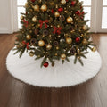 White long-pile plush tree skirt under a decorated Christmas tree on a wooden floor