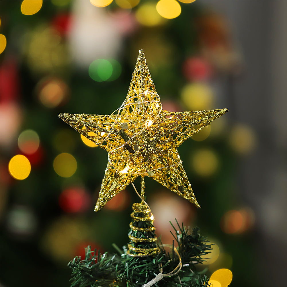 Gold glittered wire star topper with LED lights on a spiral base on top of a tree