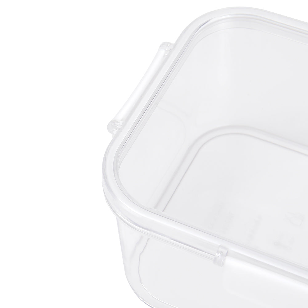 Close-up of the rounded corner of a clear box and its lid