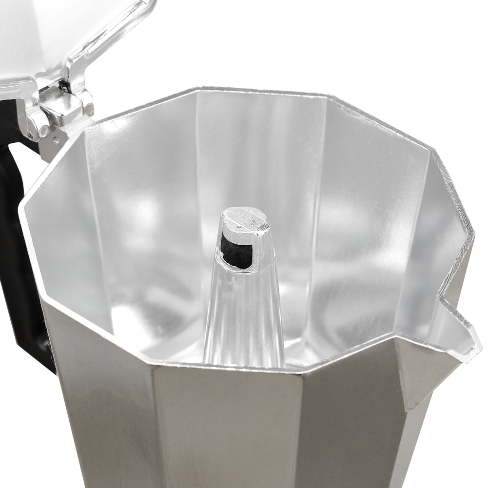 Inside the open top chamber of the moka pot, showing the central coffee column