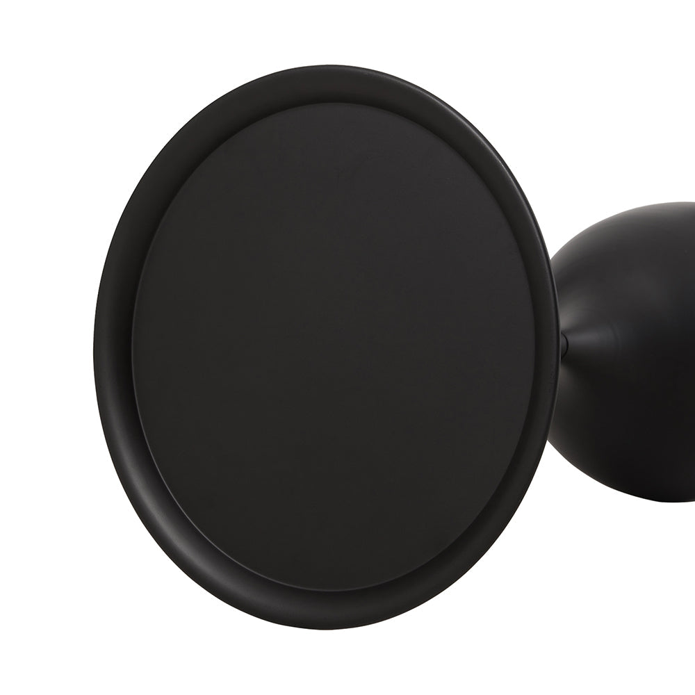 The round top of the side table seen from above at an angle