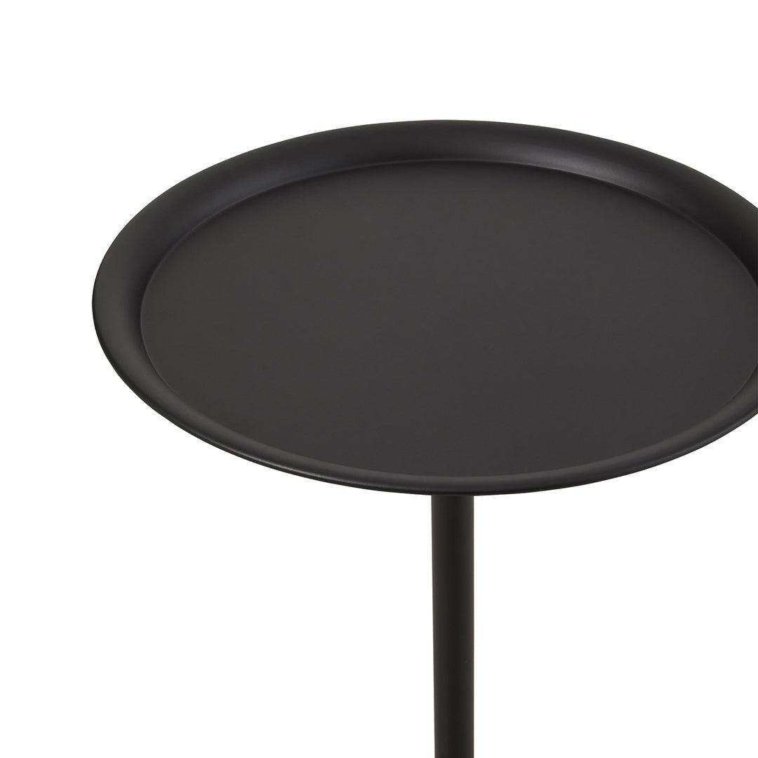 The side table's round top with the raised rim close up