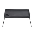 Black folding bed table with a cup holder and tablet groove on white