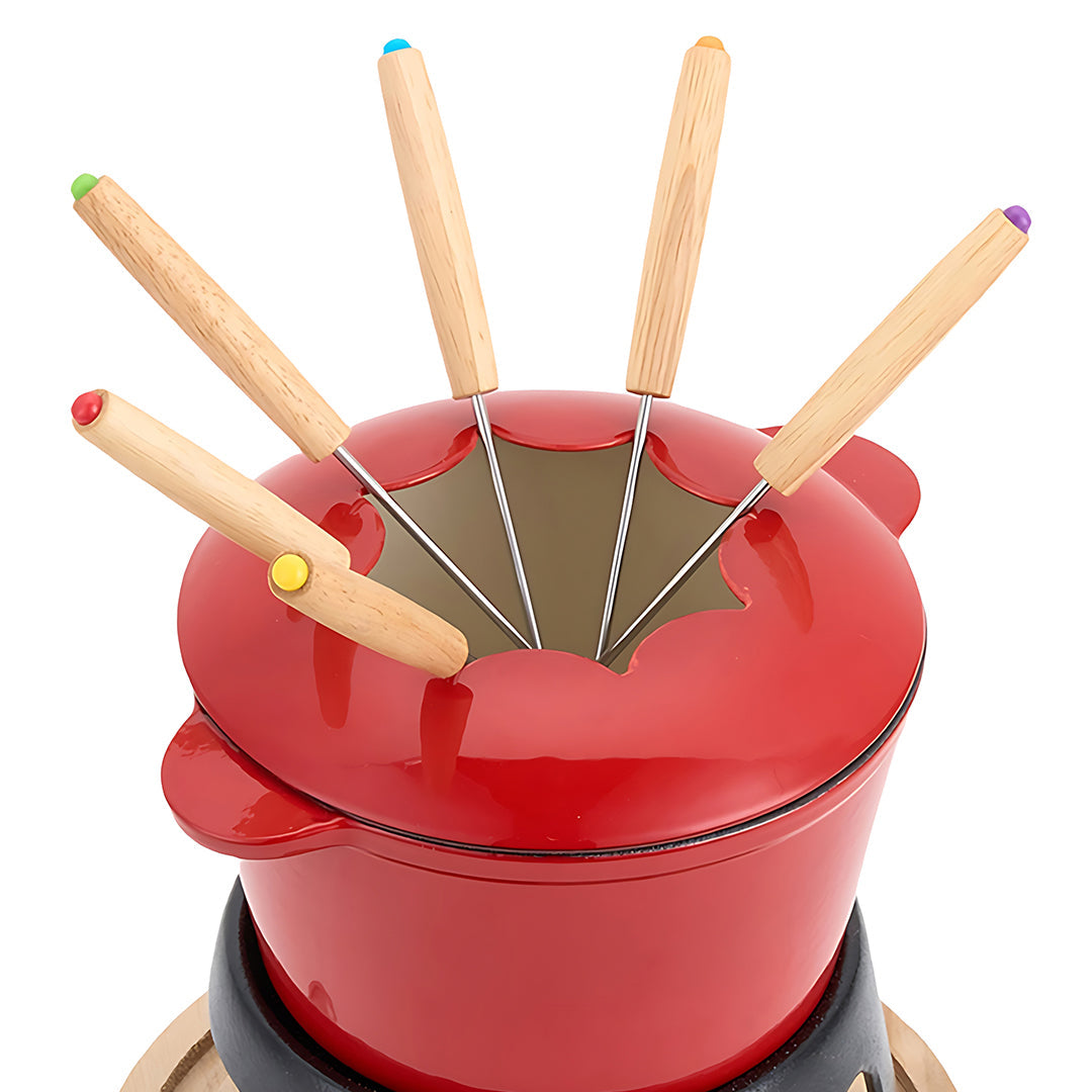 Red enamelled fondue pot with a star-cut lid holding six wooden forks with coloured caps