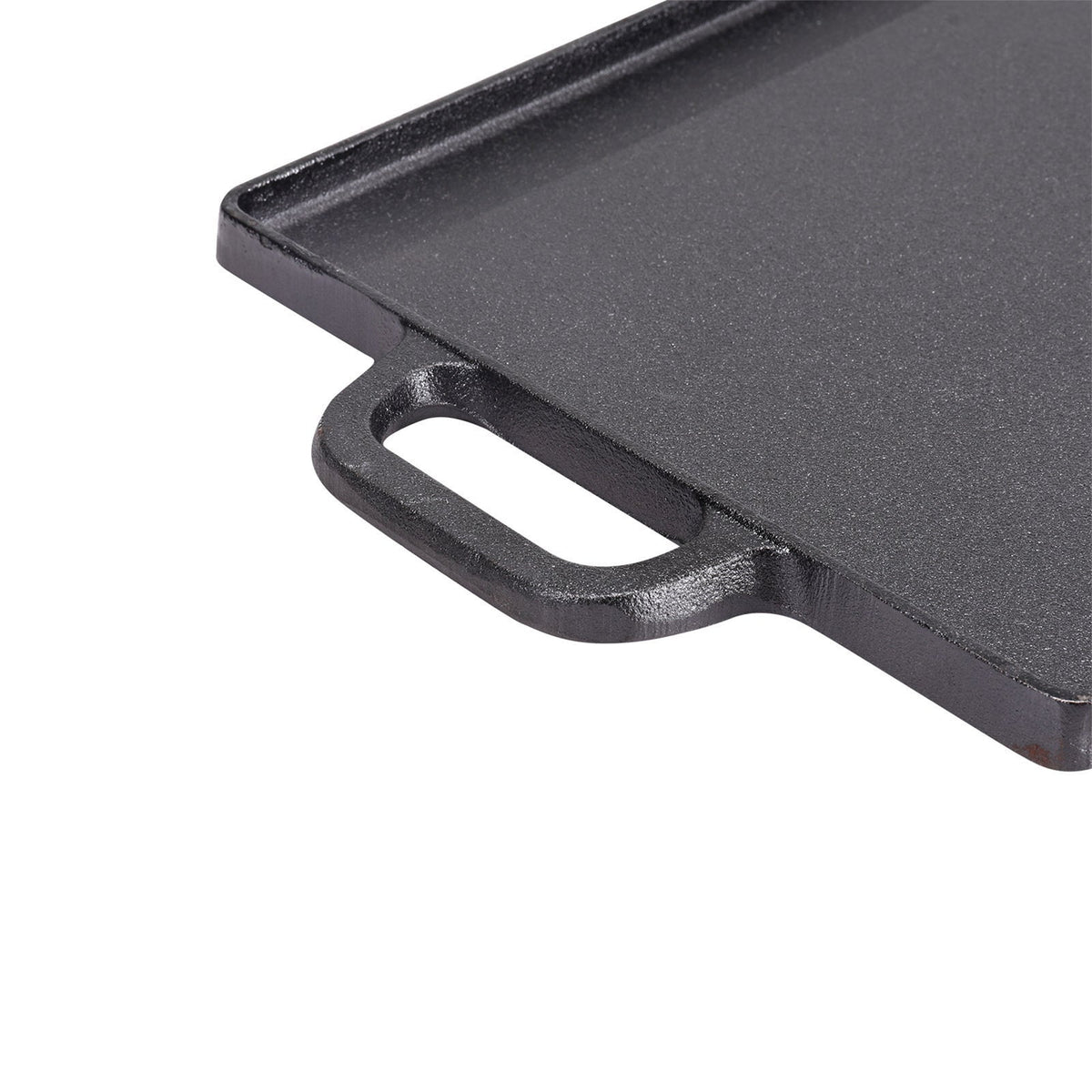 Close-up of the cast iron loop handle at one end of the griddle