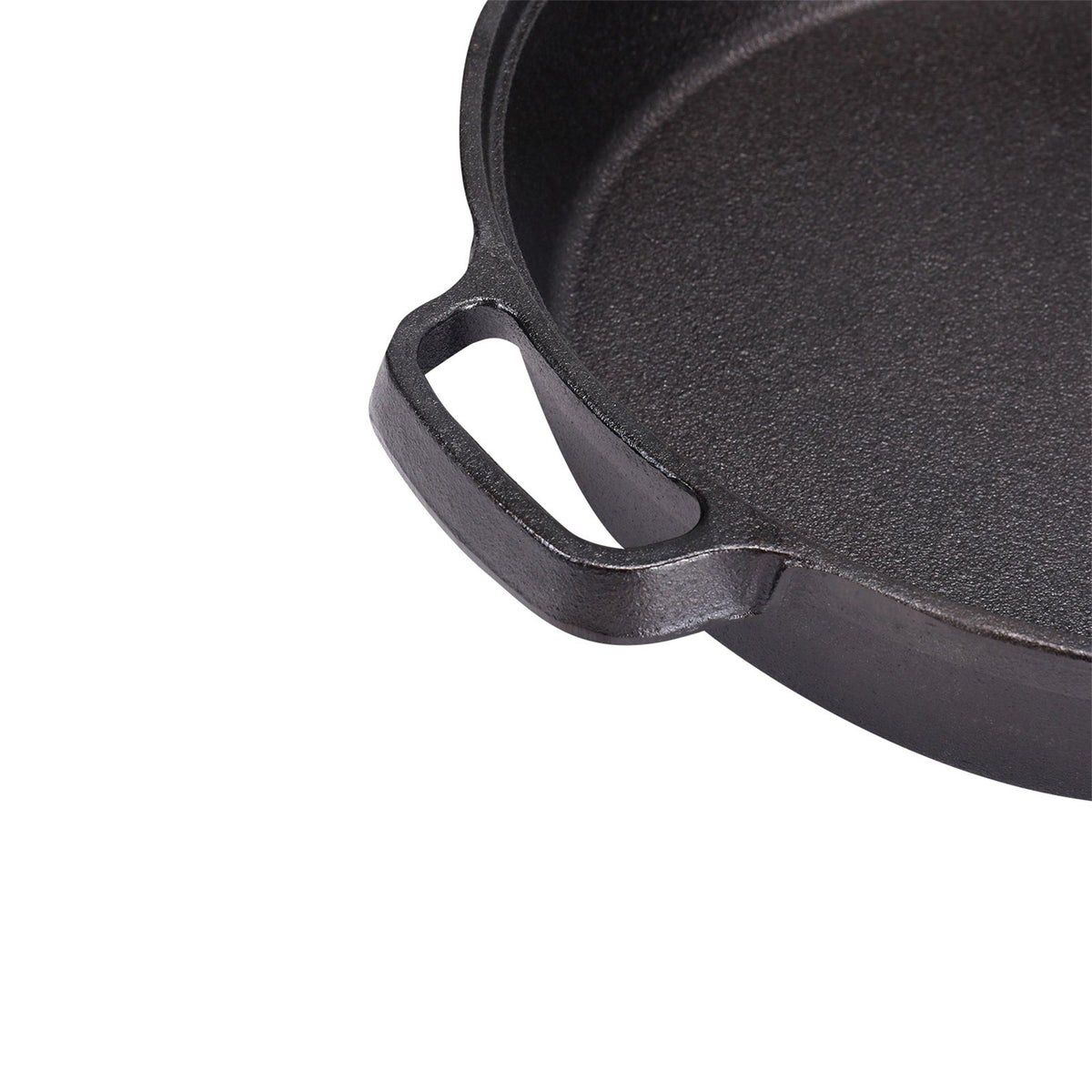 Close-up of the other side handle and the pan wall of the cast iron skillet