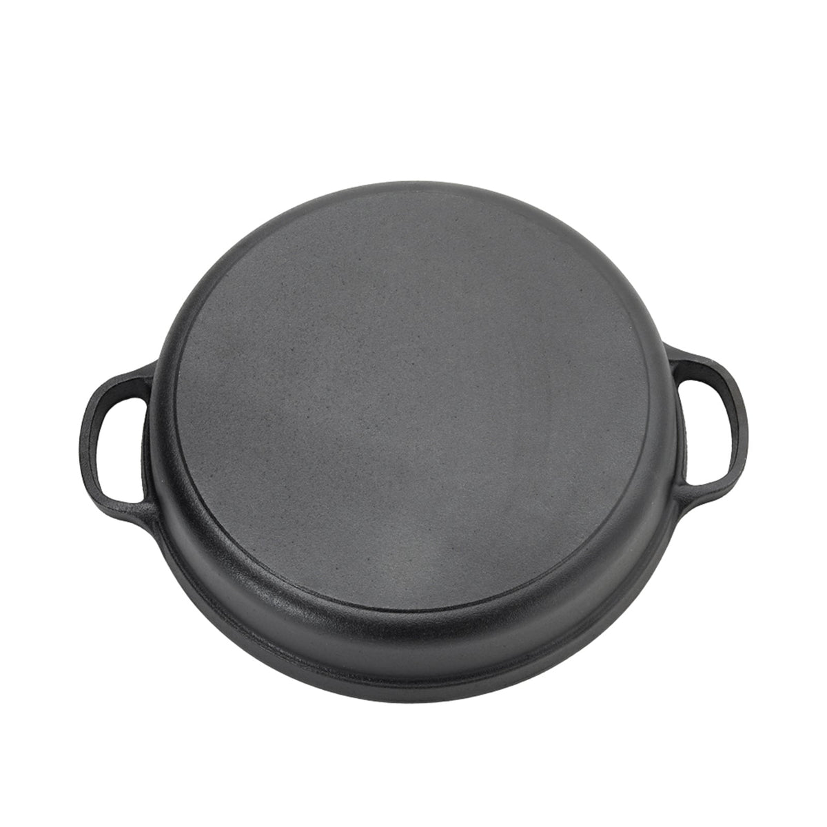 Underside of the cast iron skillet showing its flat base and two loop handles