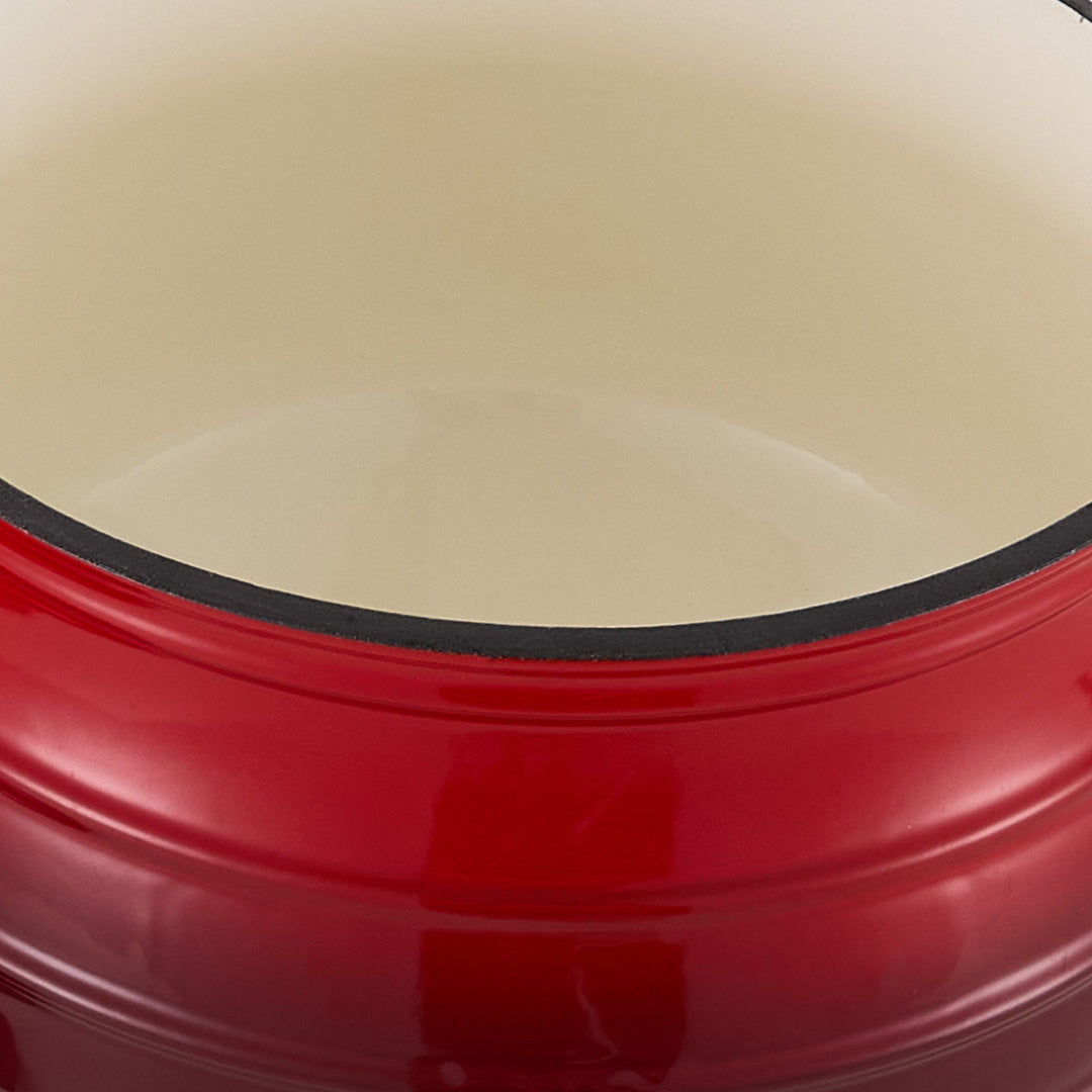 Close-up of the milky white enamel inside the red cauldron