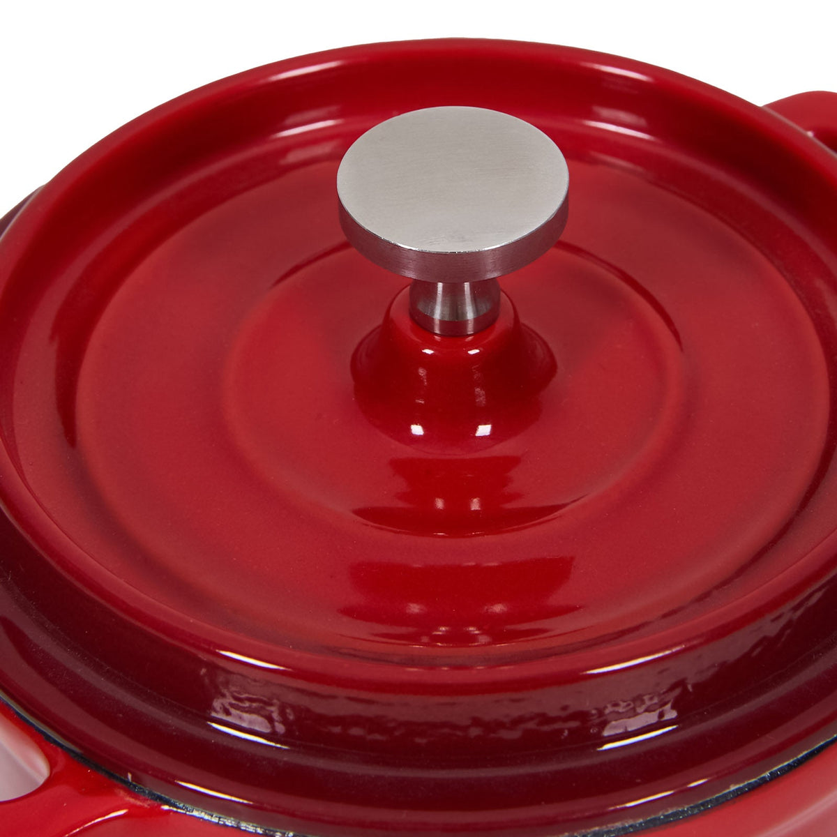 Close-up of the red ringed lid and its brushed stainless steel knob