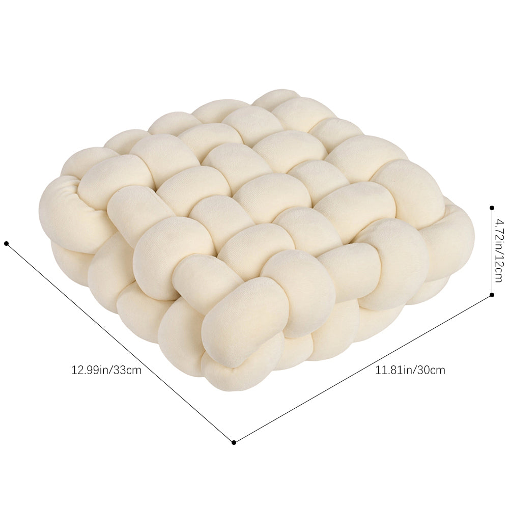 Cream knotted cushion on white with lines marking 33 cm, 30 cm and 12 cm