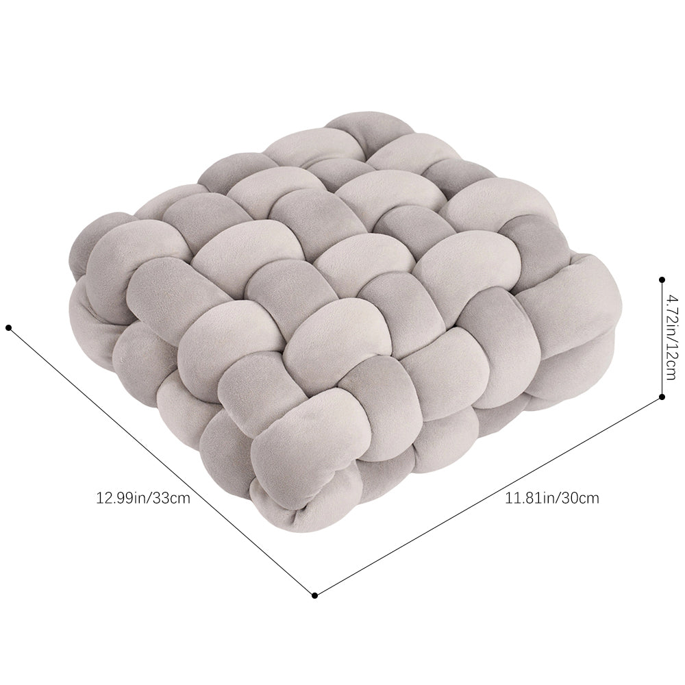 Grey knotted cushion on white with lines marking 33 cm, 30 cm and 12 cm