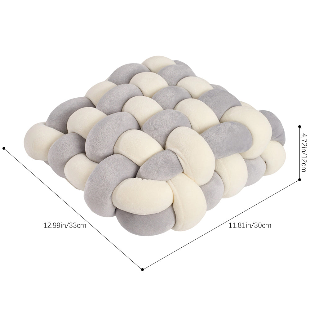 Cream and grey knotted cushion on white with lines marking 33 cm, 30 cm and 12 cm
