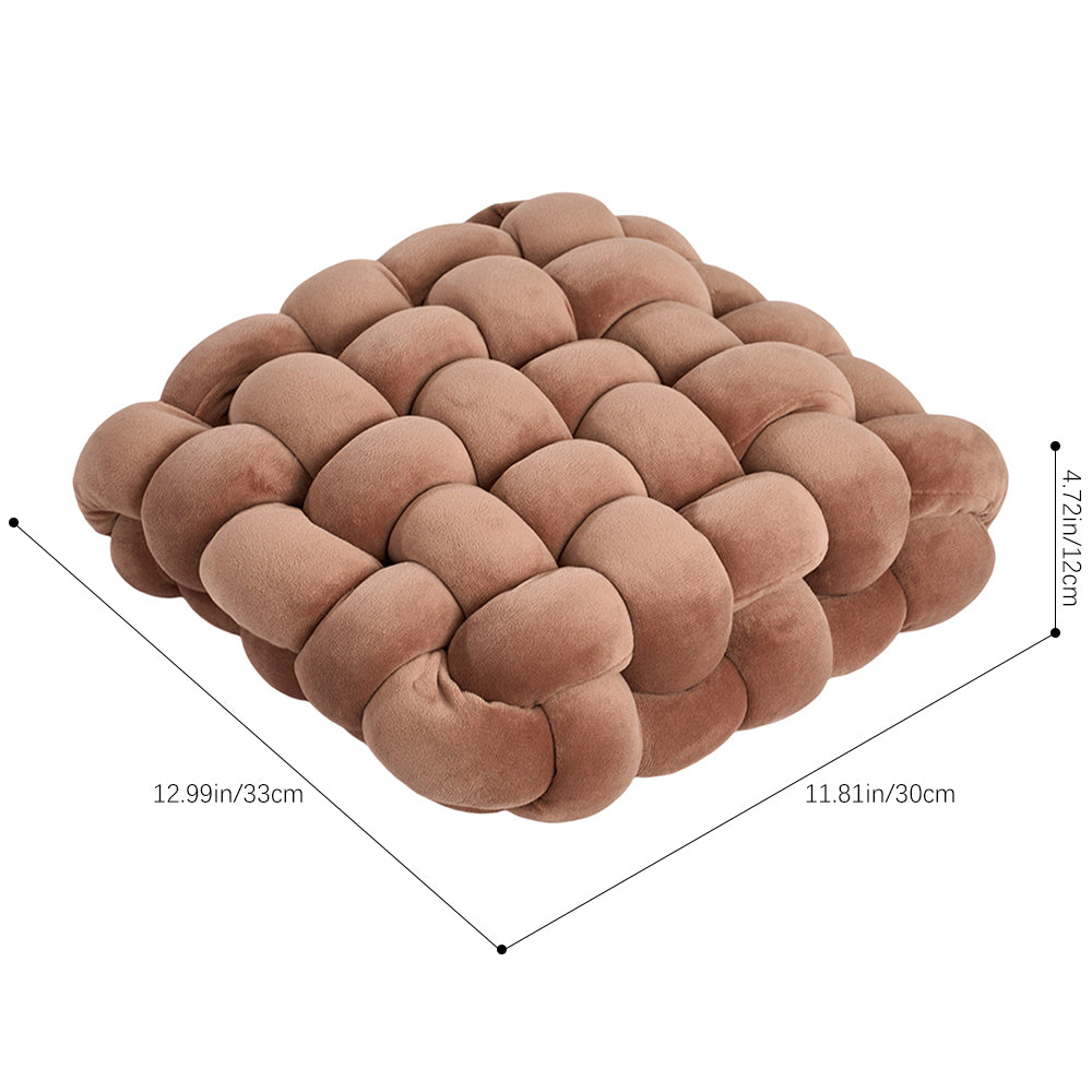 Caramel brown knotted cushion on white with lines marking 33 cm, 30 cm and 12 cm