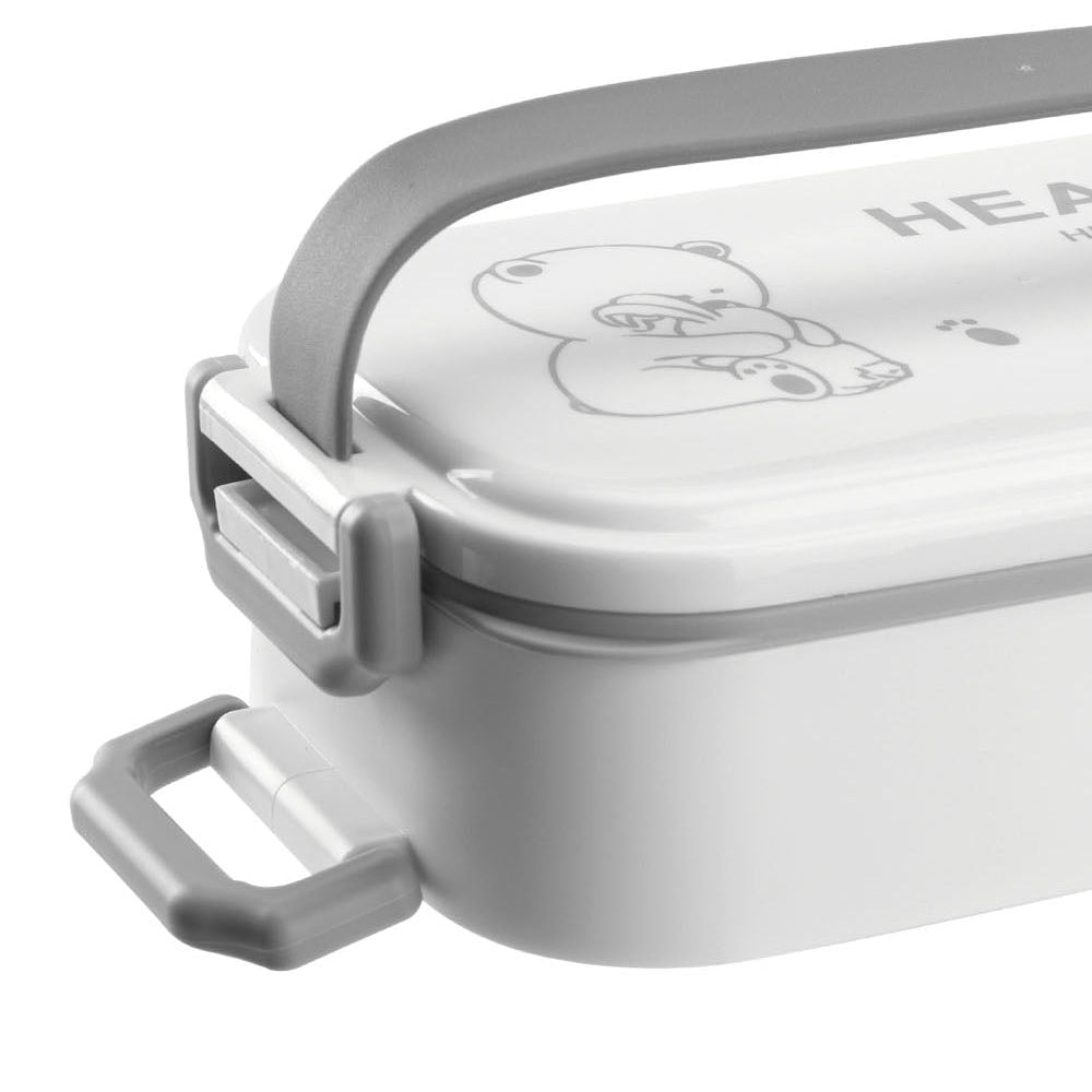 Close-up of the grey carry handle and printed white lid