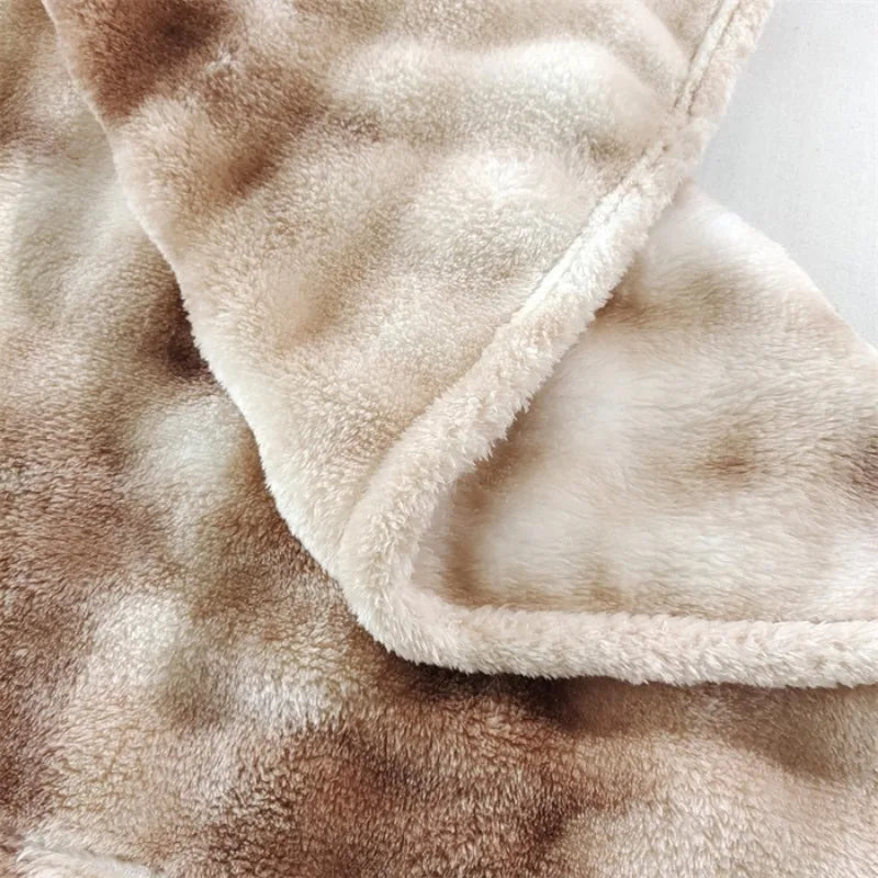 Close-up of the folded blanket edge showing plush on both sides