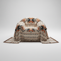 Cream woven throw with orange and black eight-point stars and chevron rows draped over an armchair, on a grey background