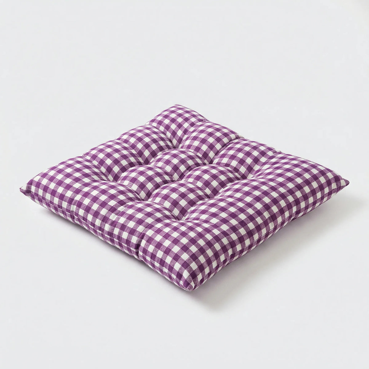 Purple gingham tufted seat cushion seen from the front