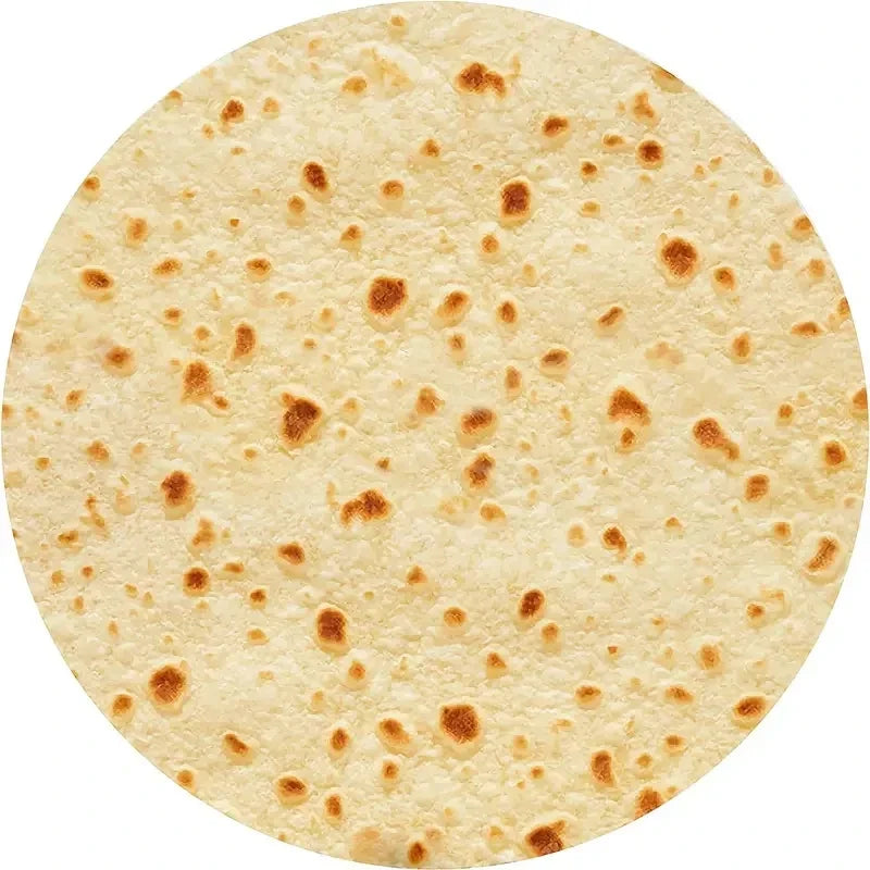 Round tortilla-print blanket on white, showing toasted brown spots on a beige ground