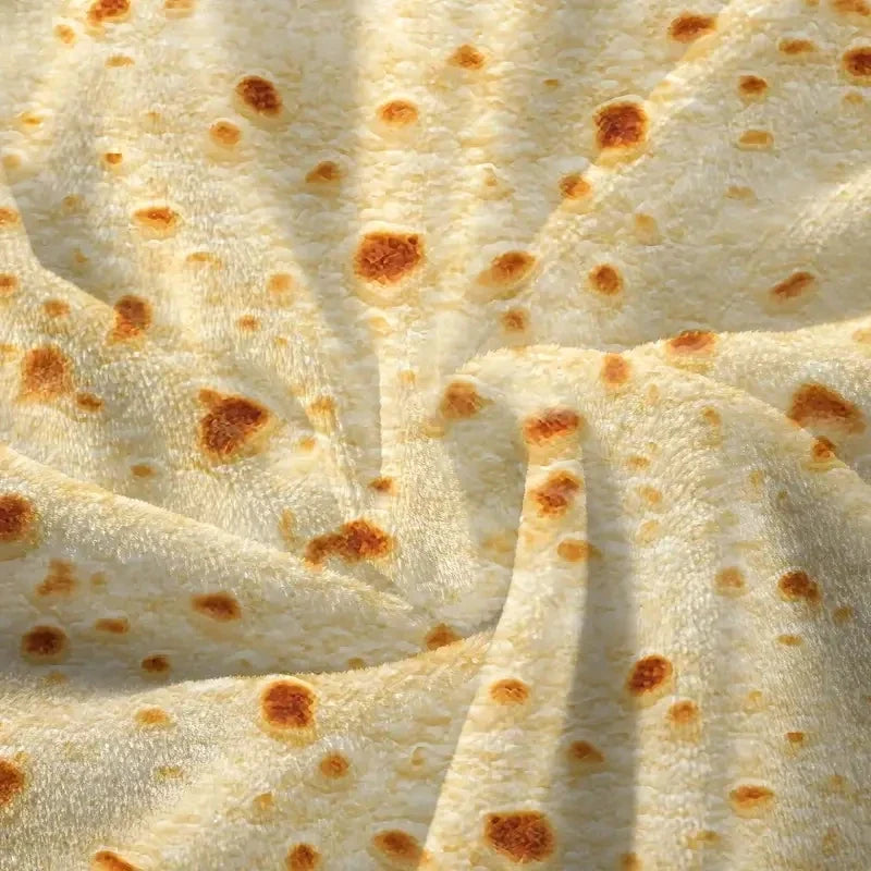 Close-up of the soft coral fleece with its tortilla print in folds