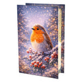 Glass light box printed with a robin on a snowy berry branch, standing on white