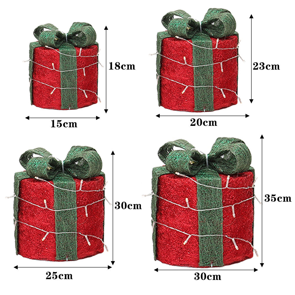 Four red gift boxes with green bows on white, marked 15 × 18, 20 × 23, 25 × 30 and 30 × 35 cm