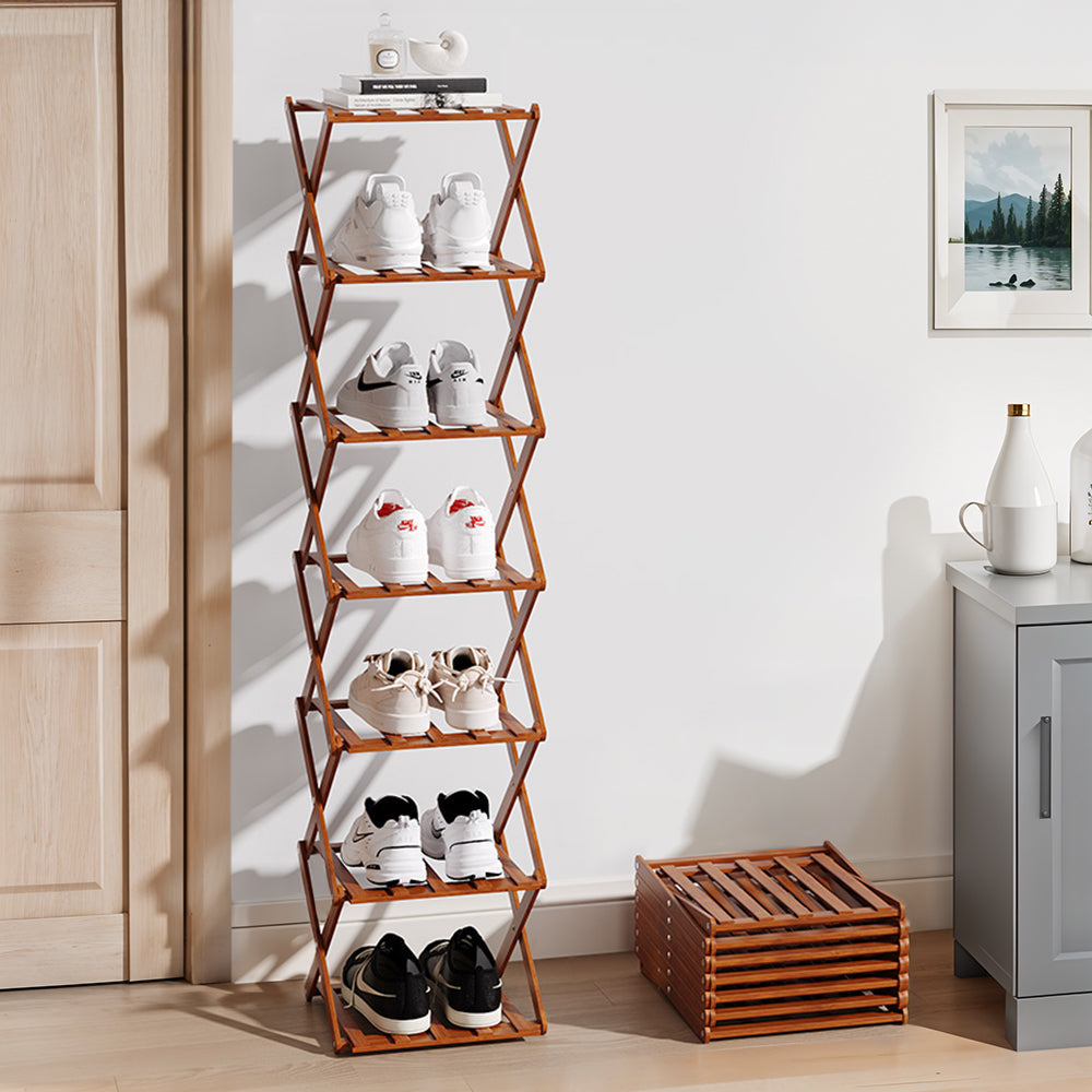 Tall dark brown shoe rack filled with shoes and boots