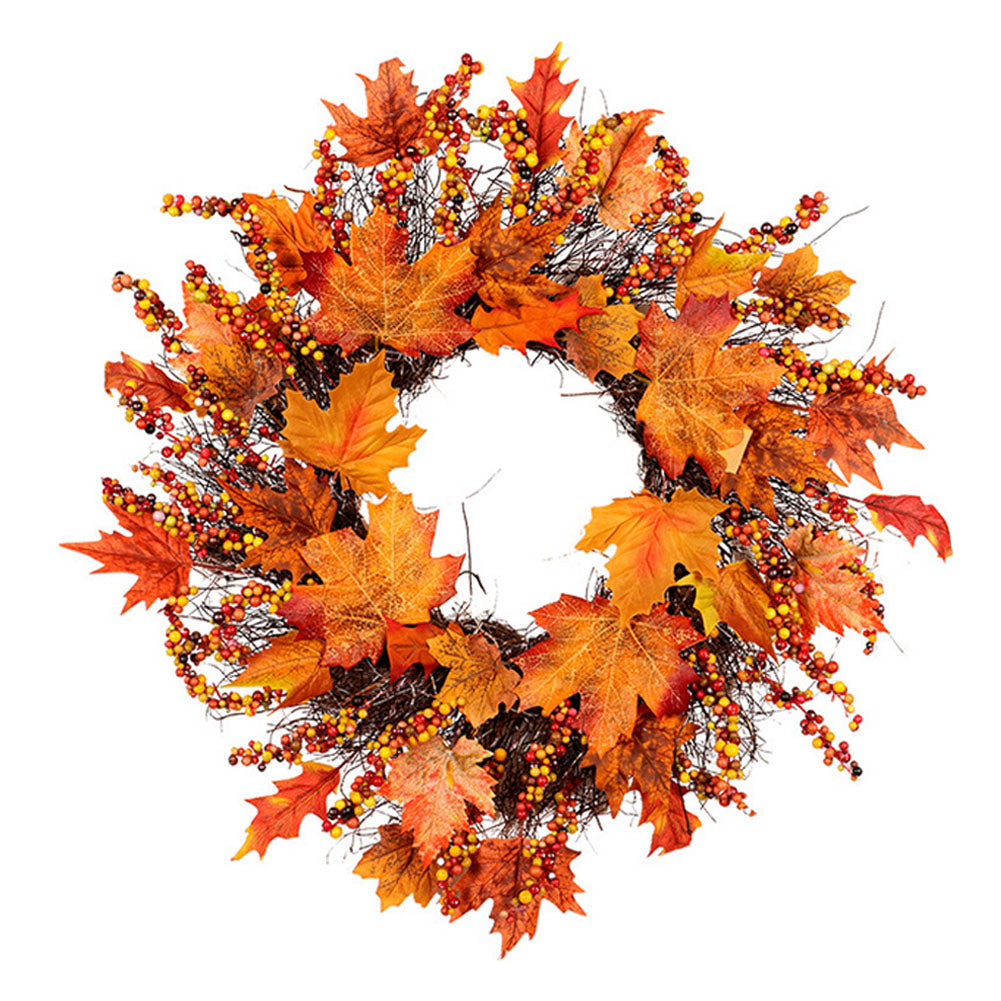 Artificial wreath of orange and red maple leaves and glossy berries on a twig base, on white