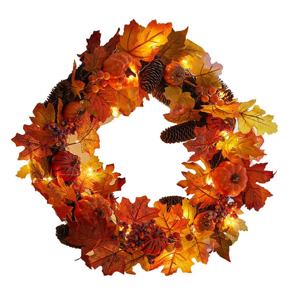 Full autumn wreath of maple leaves, orange pumpkins, pine cones and berries with lights on, on white