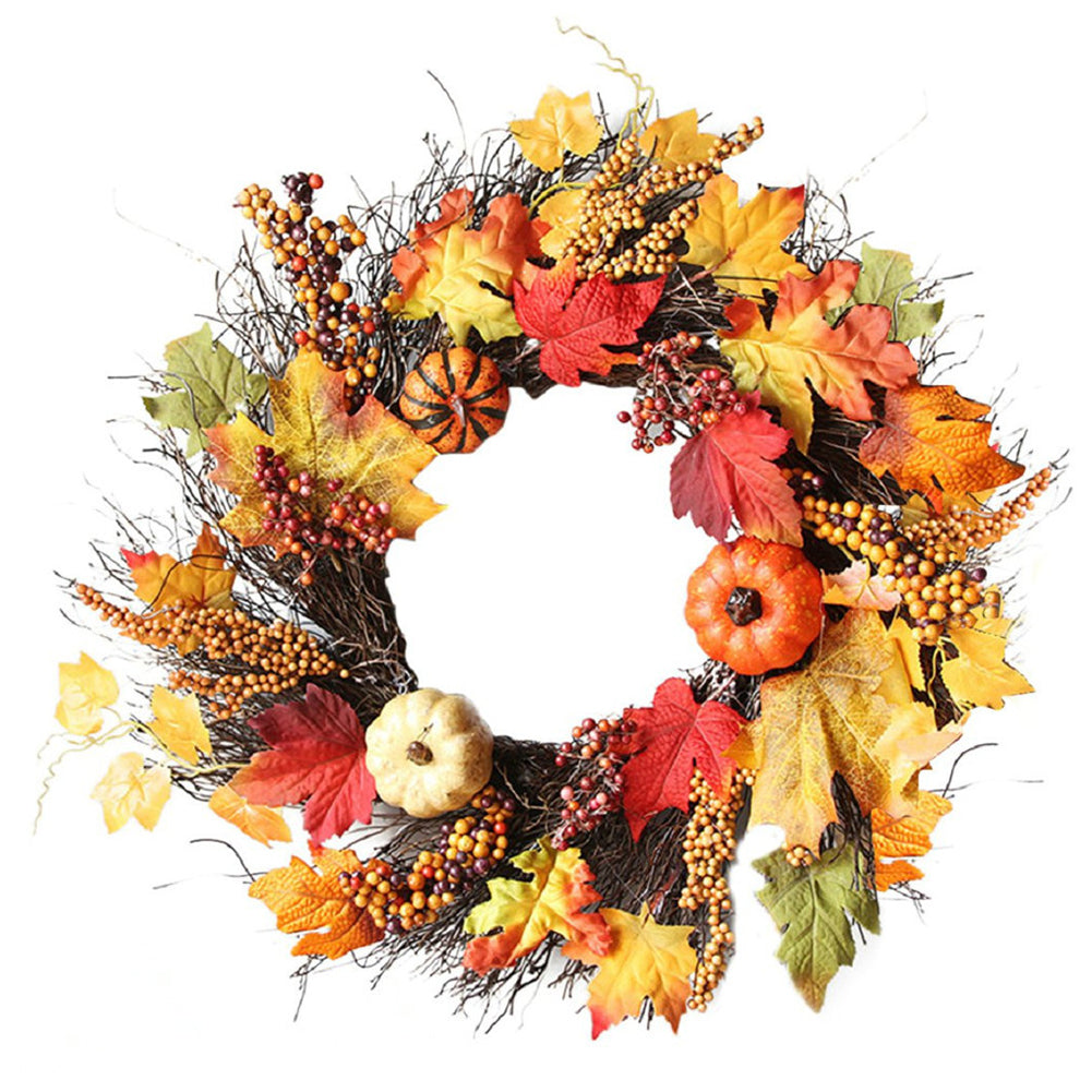 Round autumn wreath with maple leaves, berry clusters and orange and cream pumpkins on white