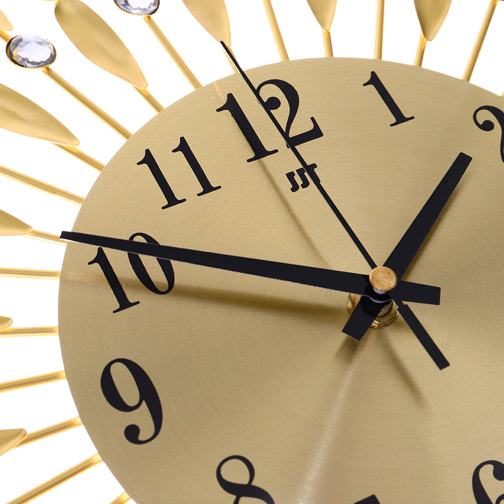Close-up of the gold dial and black hands of the wall clock