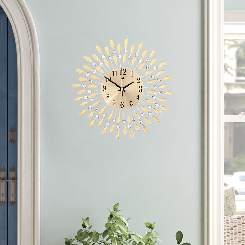 The gold crystal wall clock on a pale wall beside an arched doorway