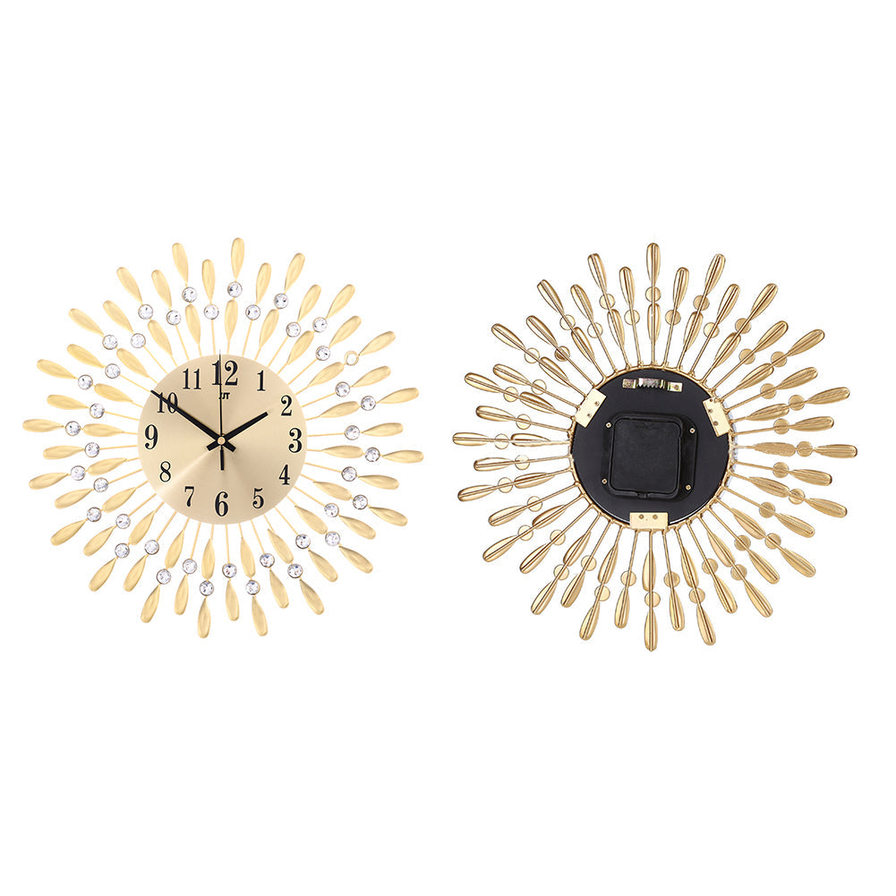 Front and back of the gold wall clock side by side on white