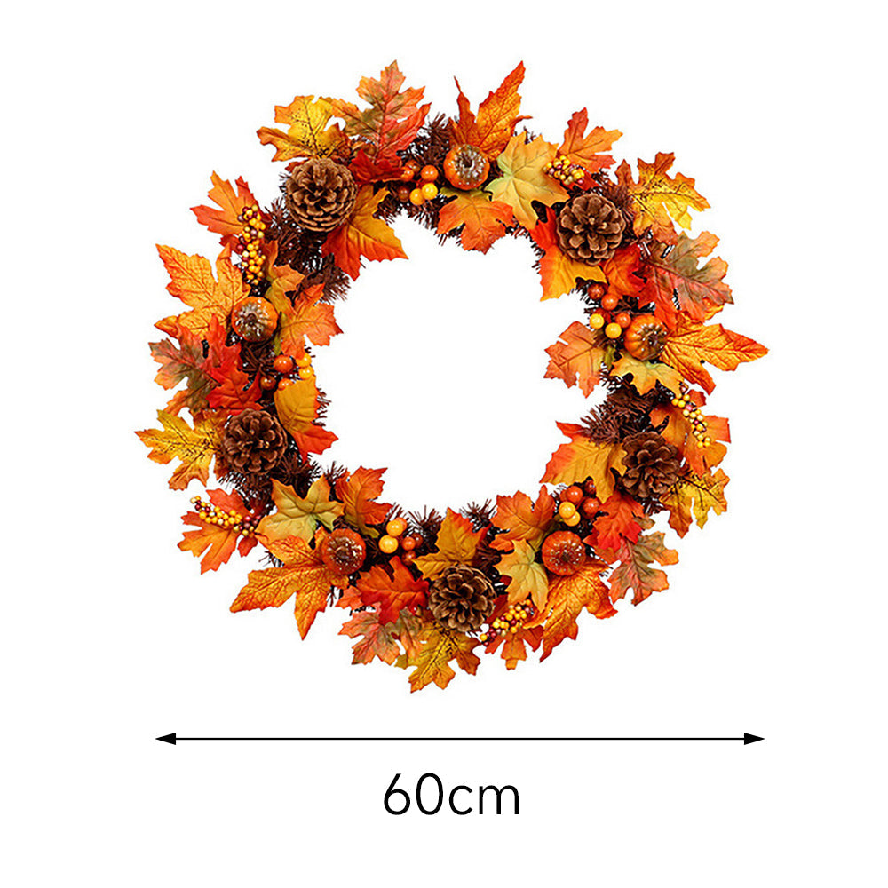 The orange autumn wreath on white with a line marking its 60 cm width