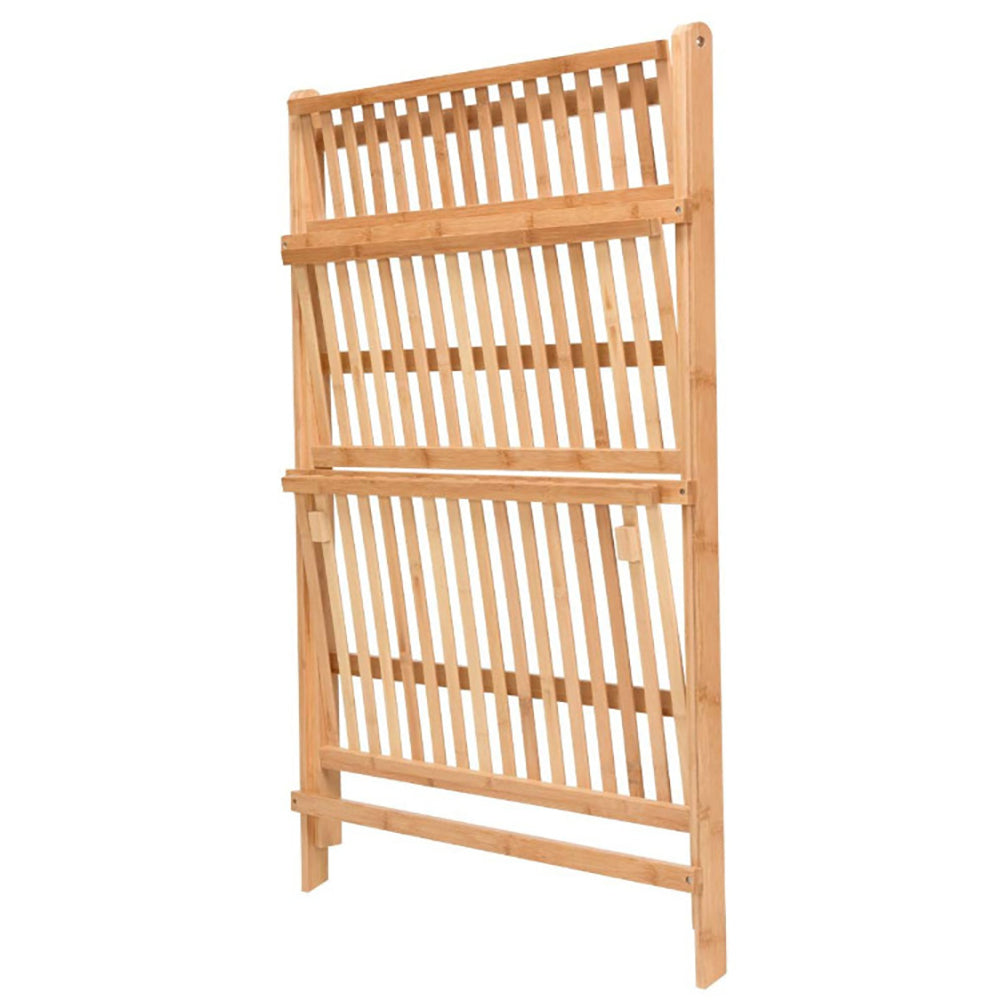 The natural wood plant stand folded flat on white