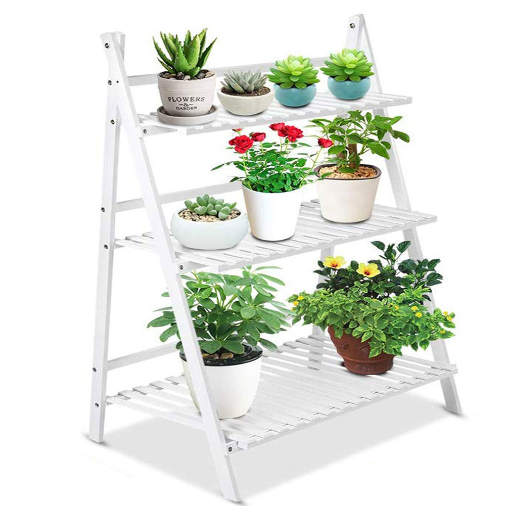 White ladder plant stand on white with succulents, roses and yellow flowers