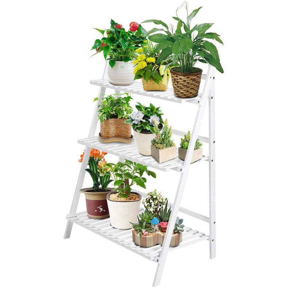 White ladder plant stand on white filled with flowering pot plants