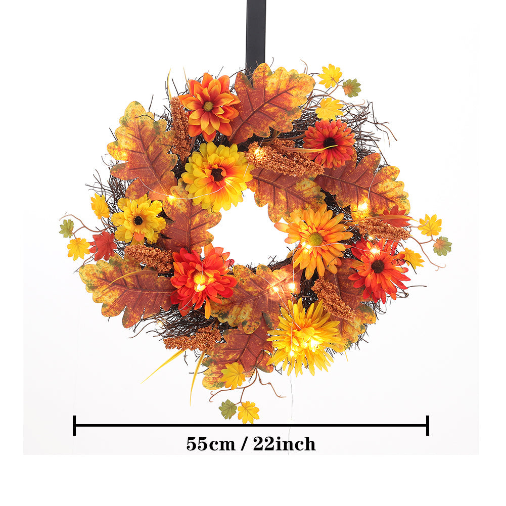 The daisy wreath hanging from a hook with a line marking its 55 cm width