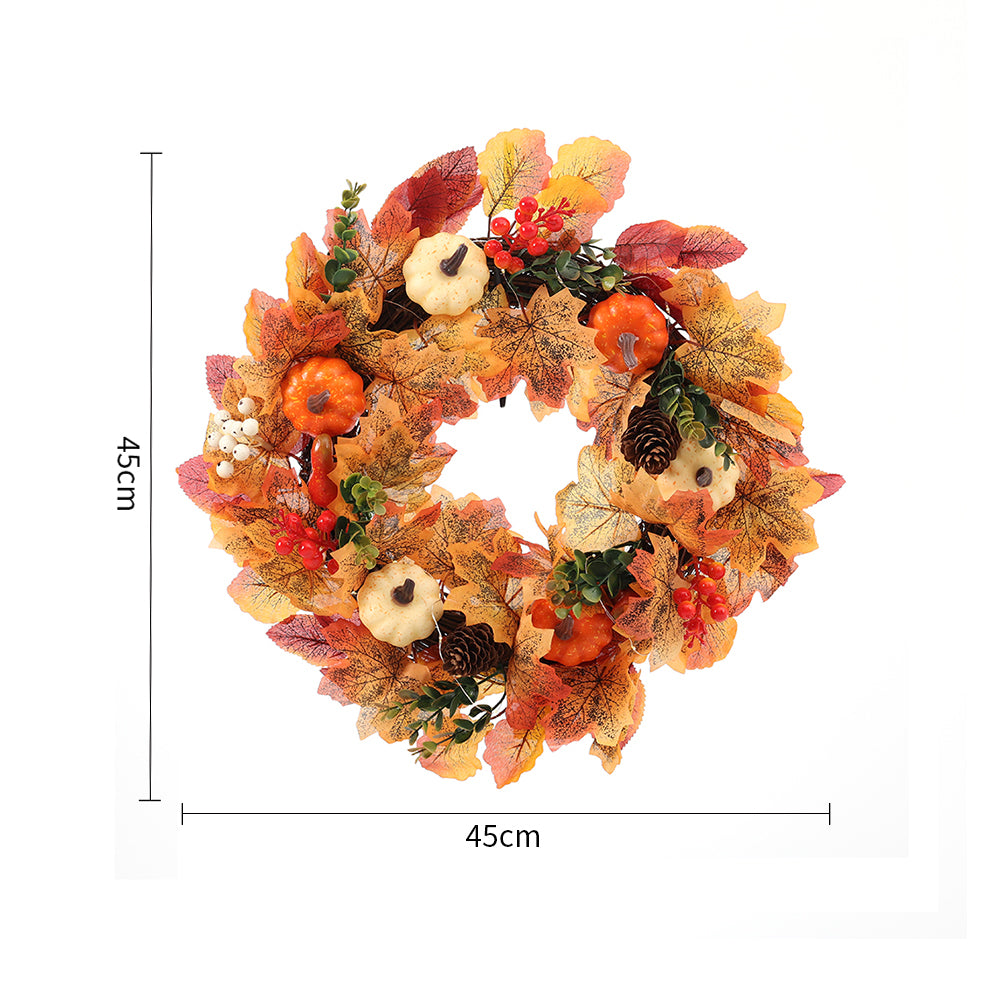 The pumpkin wreath on white with lines marking its 45 cm size