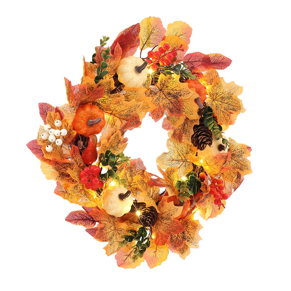 Autumn wreath with white and orange pumpkins, maple leaves, red berries and pine cones on white