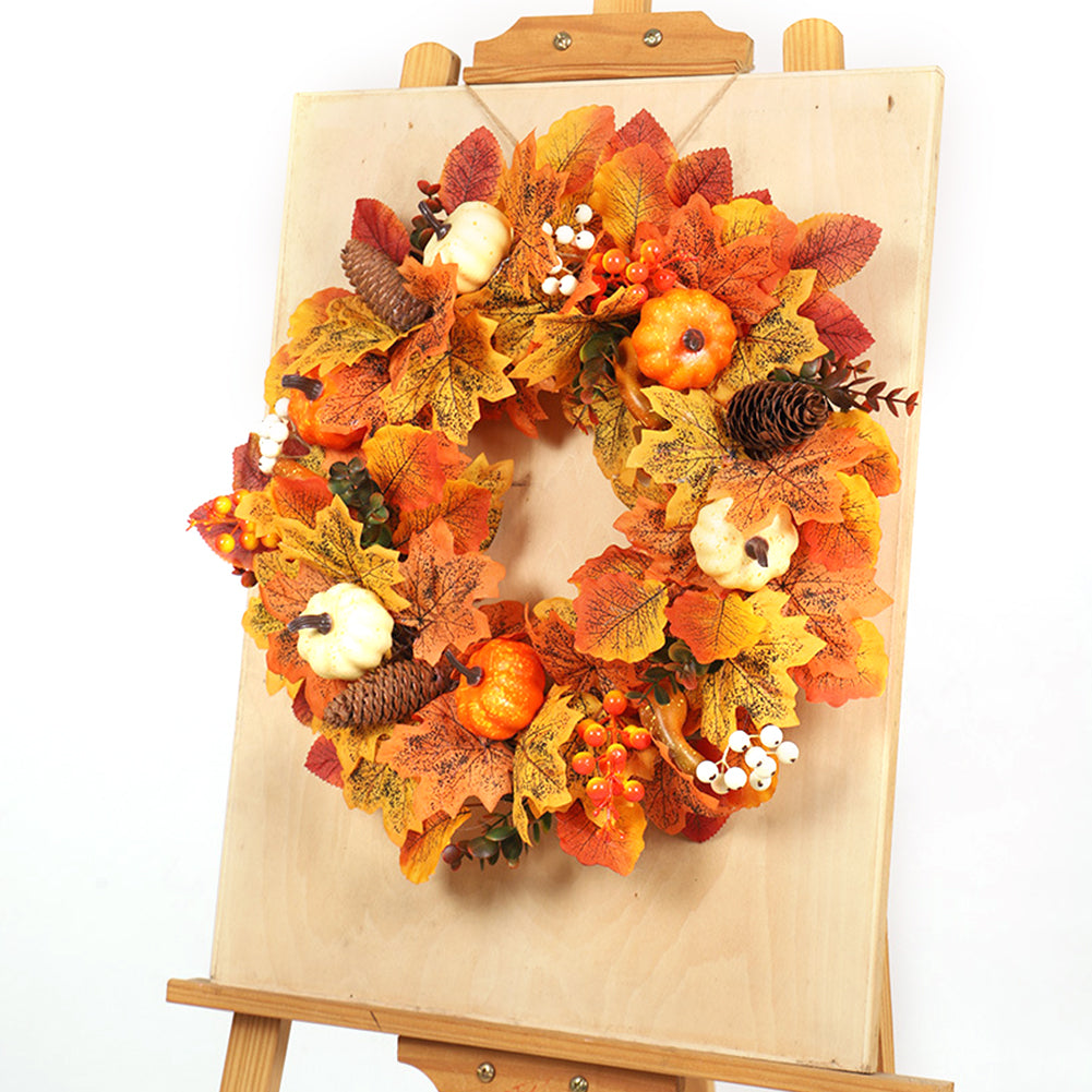 The pumpkin wreath standing on a wooden easel