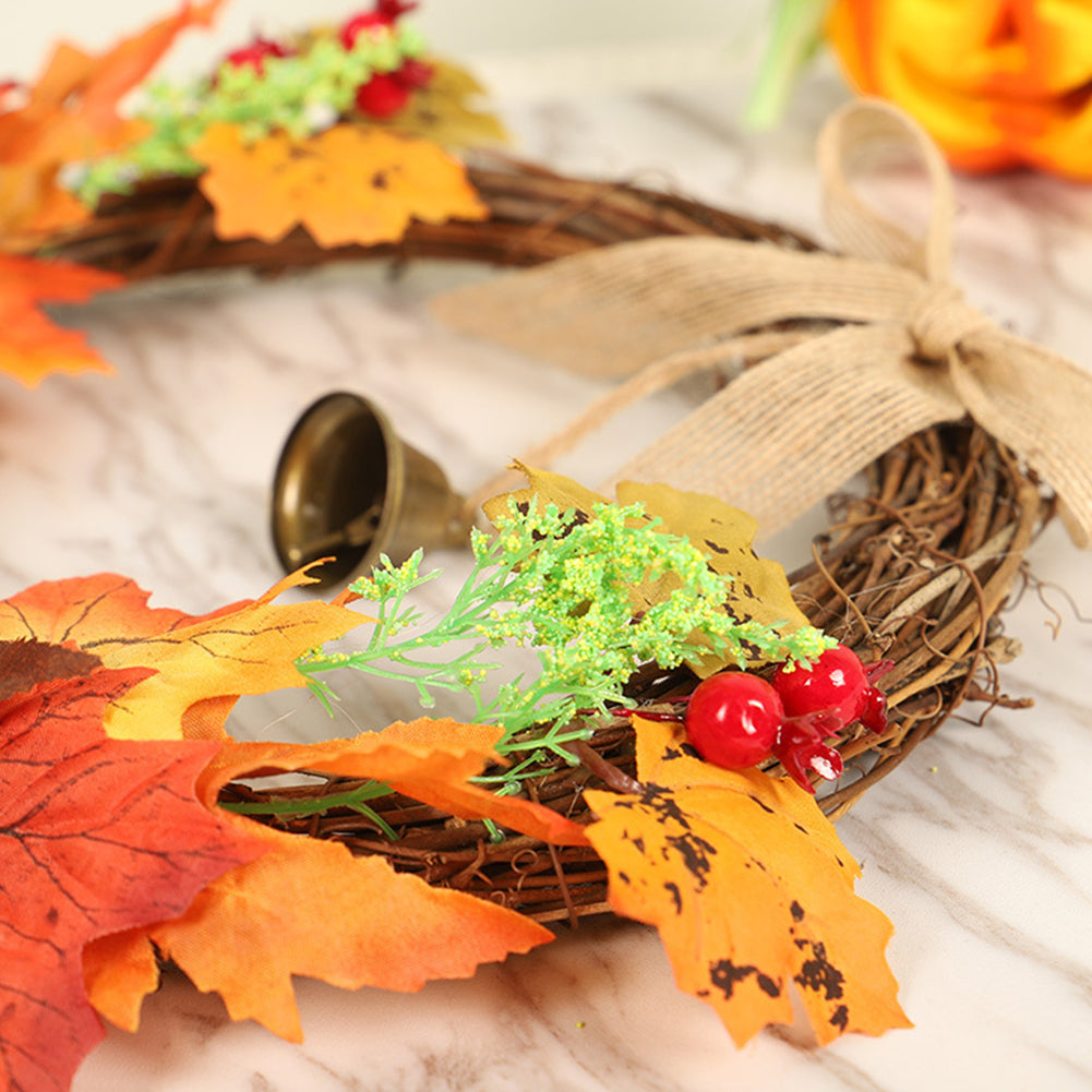 Close-up of the brass bell, burlap bow and red berries on the branch ring