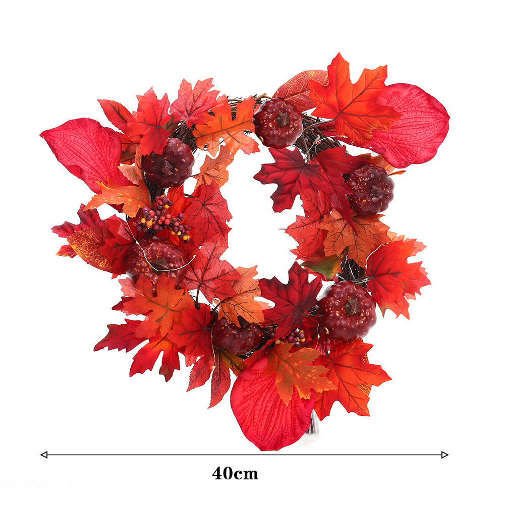 Red maple leaf and pumpkin wreath on white with a 40 cm width marked below it