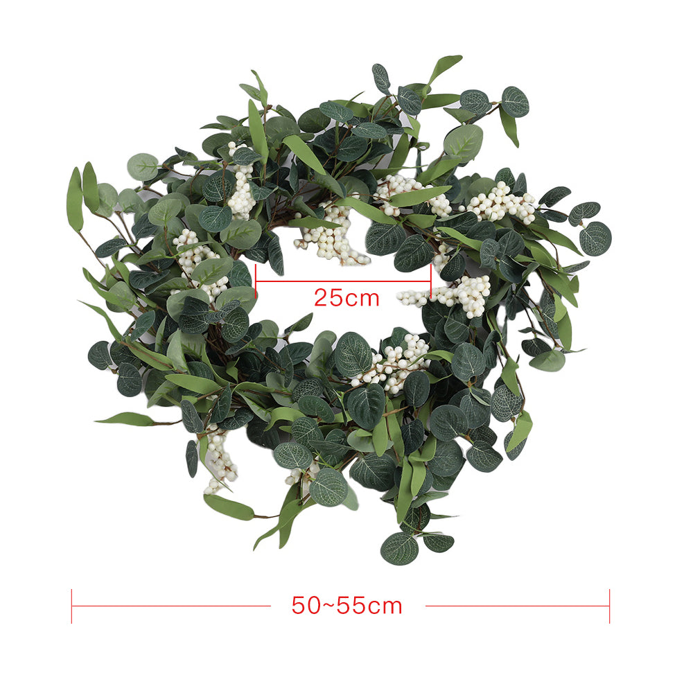 Eucalyptus wreath on white with lines marking 50 to 55 cm across and a 25 cm opening